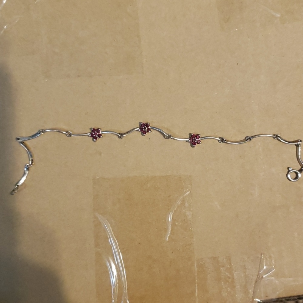 Sterling silver bracelet with 3 ruby flowers